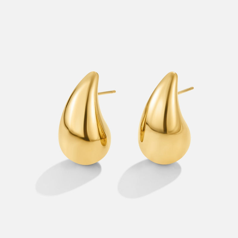 Anne – Boucles d’oreilles créoles en or avec une courbe délicate